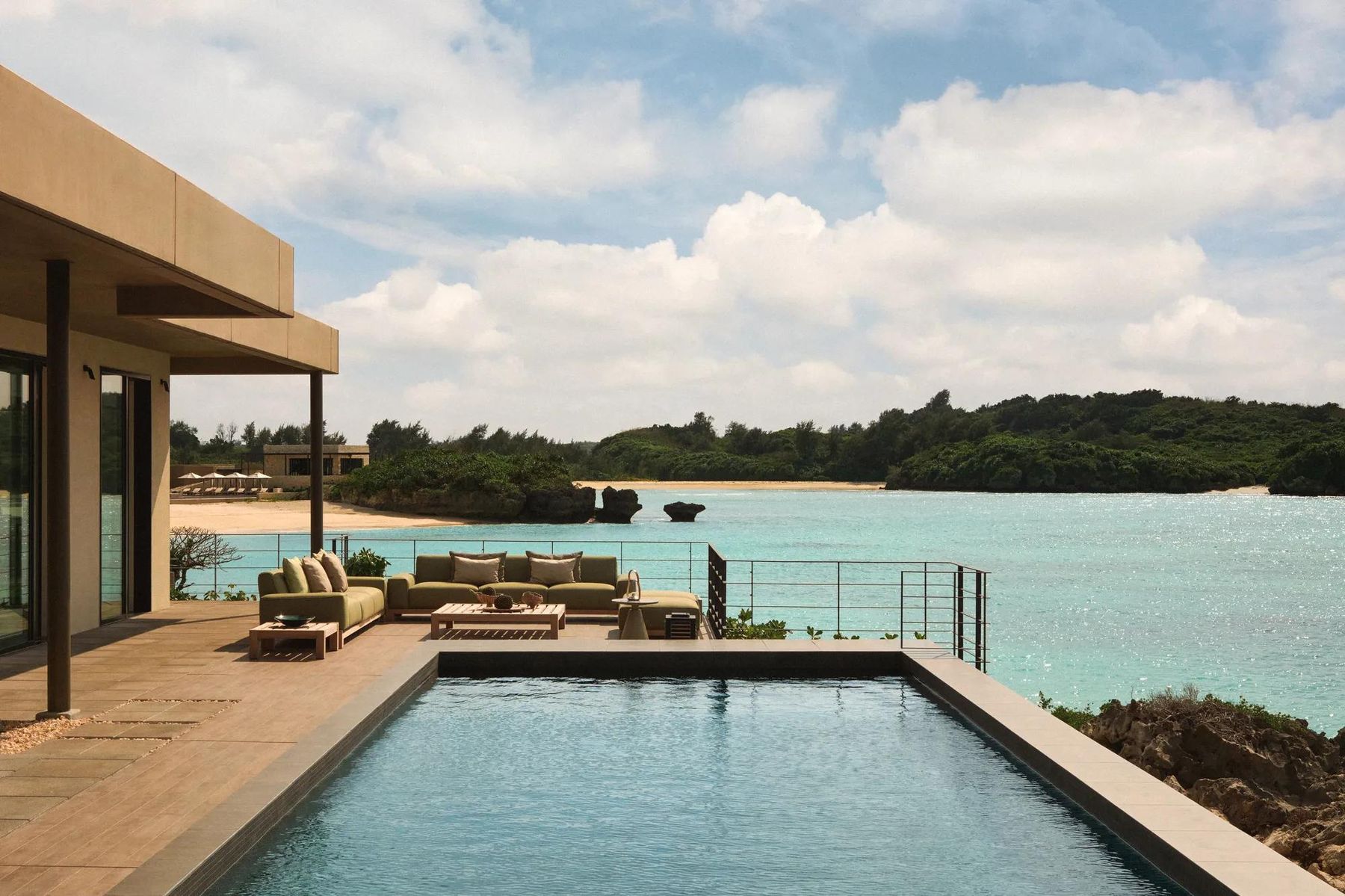 Private pool terrace looking over a turquoise bay at Rosewood Miyakojima